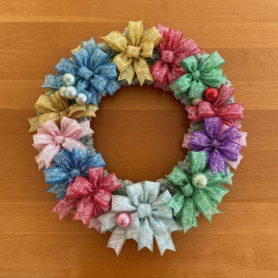 Variety of colorful ribbons and ornaments neatly arranged for wreath making, in a crafting setting, no text, no words, no typography, clean image